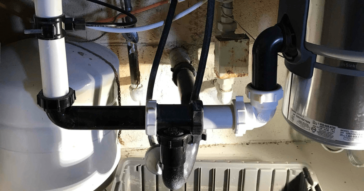 Under-sink drain piping and garbage disposal