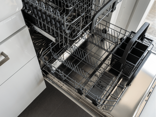 Open dishwasher with empty racks
