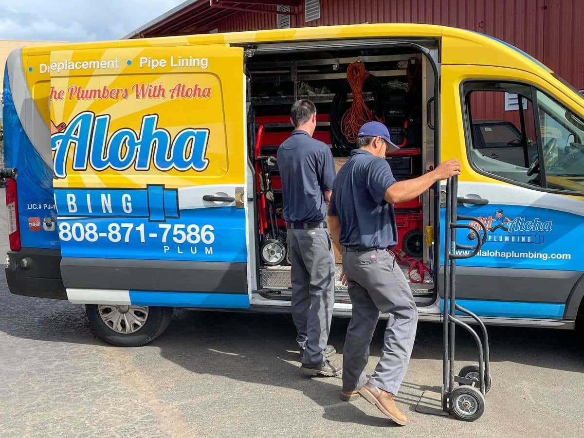 All Aloha Plumbing technicians loading equipment from a company van
